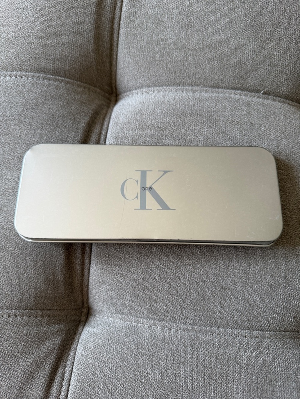 Calvin Klein silver CK One rectangular tin